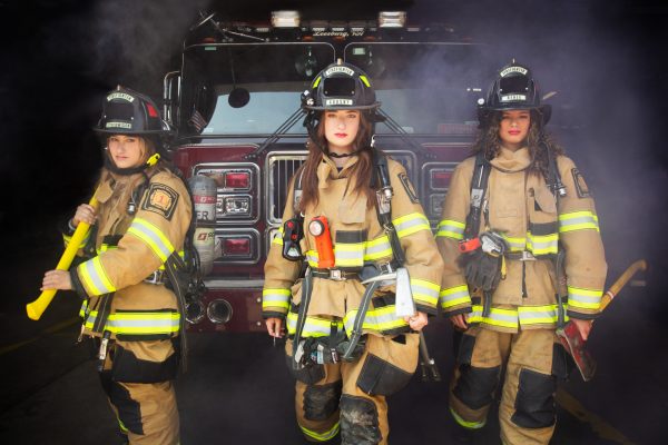 Danielle, Dani, and Kayla are suited up for firefighting